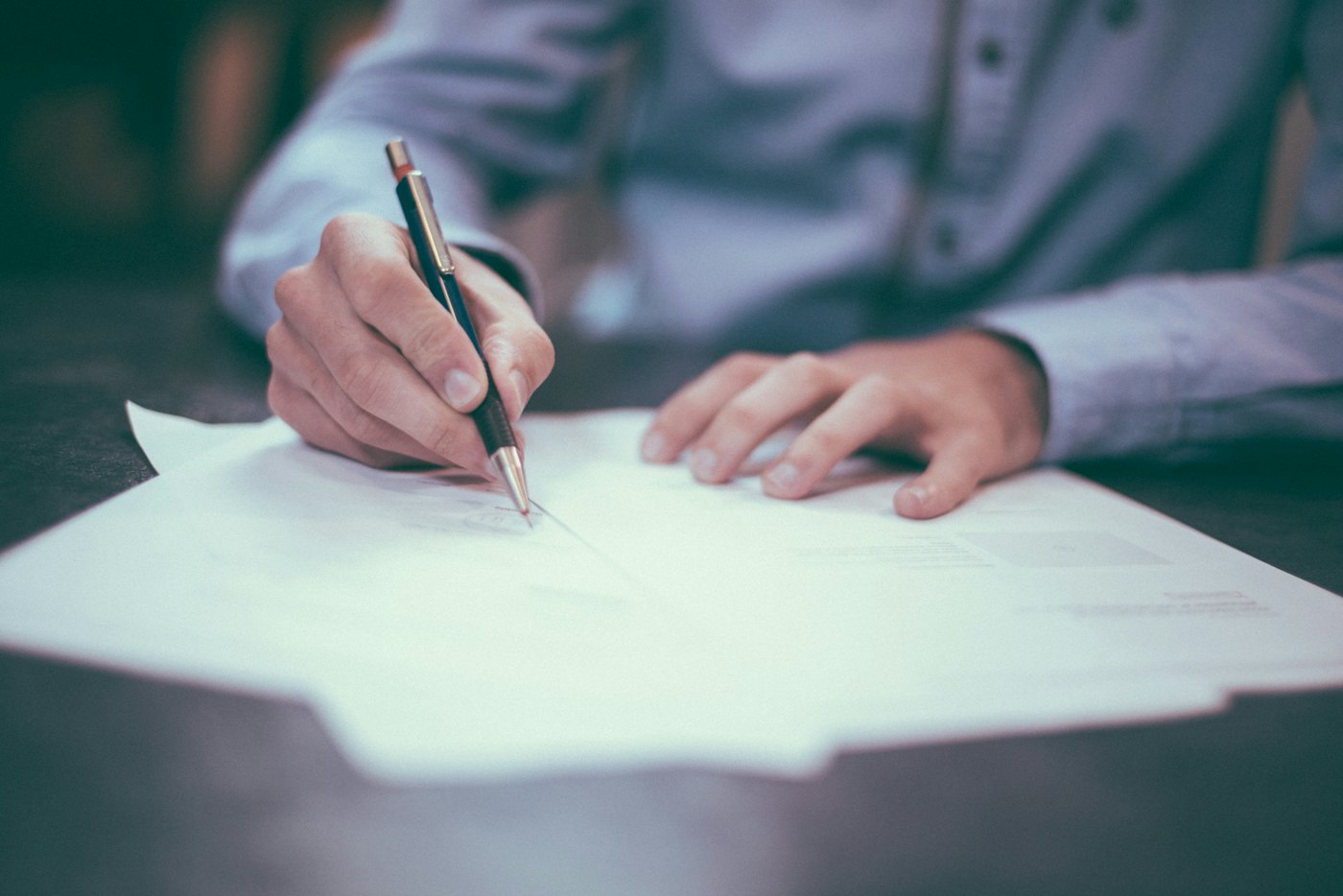 Financial documents and a pen laid out for a cross-border planning review.